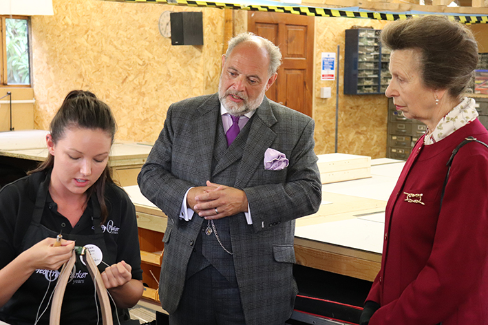 HRH The Princess Royal visits Piglets & Geoffrey Parker and is shown handle making
