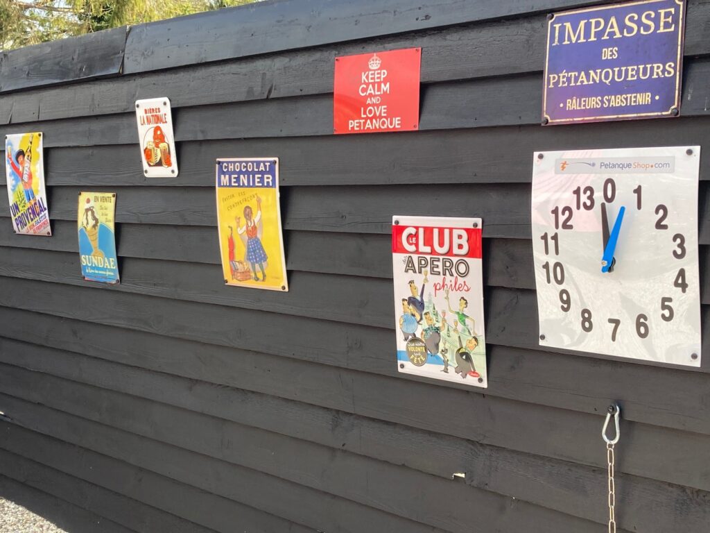 Metal advertising plaques on Piglets' French patio