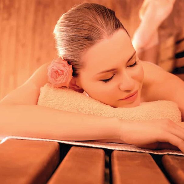 Lady relaxing in the infra-red sauna at Piglets spa