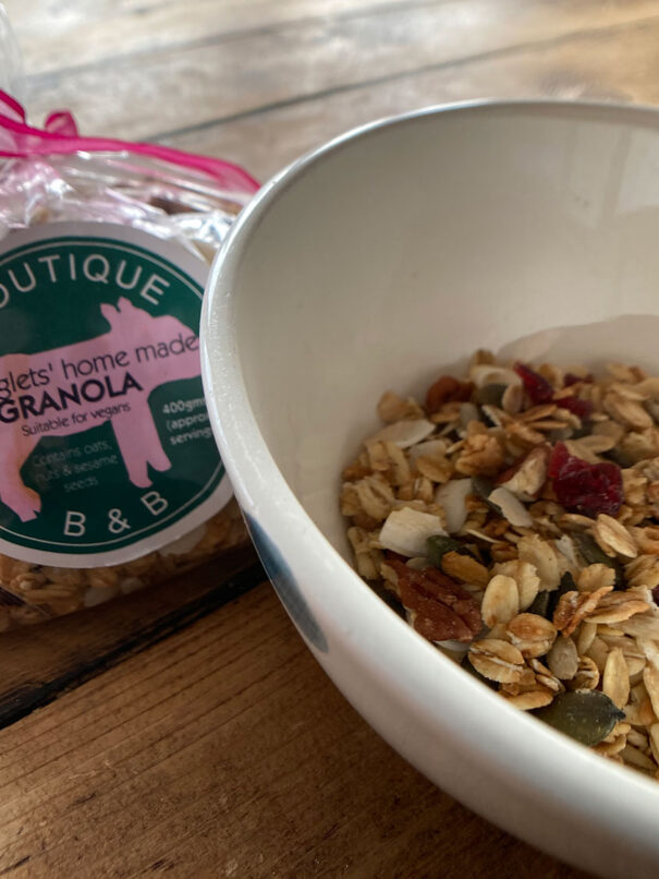Homemade granola bagged and ready to serve in a bowl at Piglets Boutique Country Stay